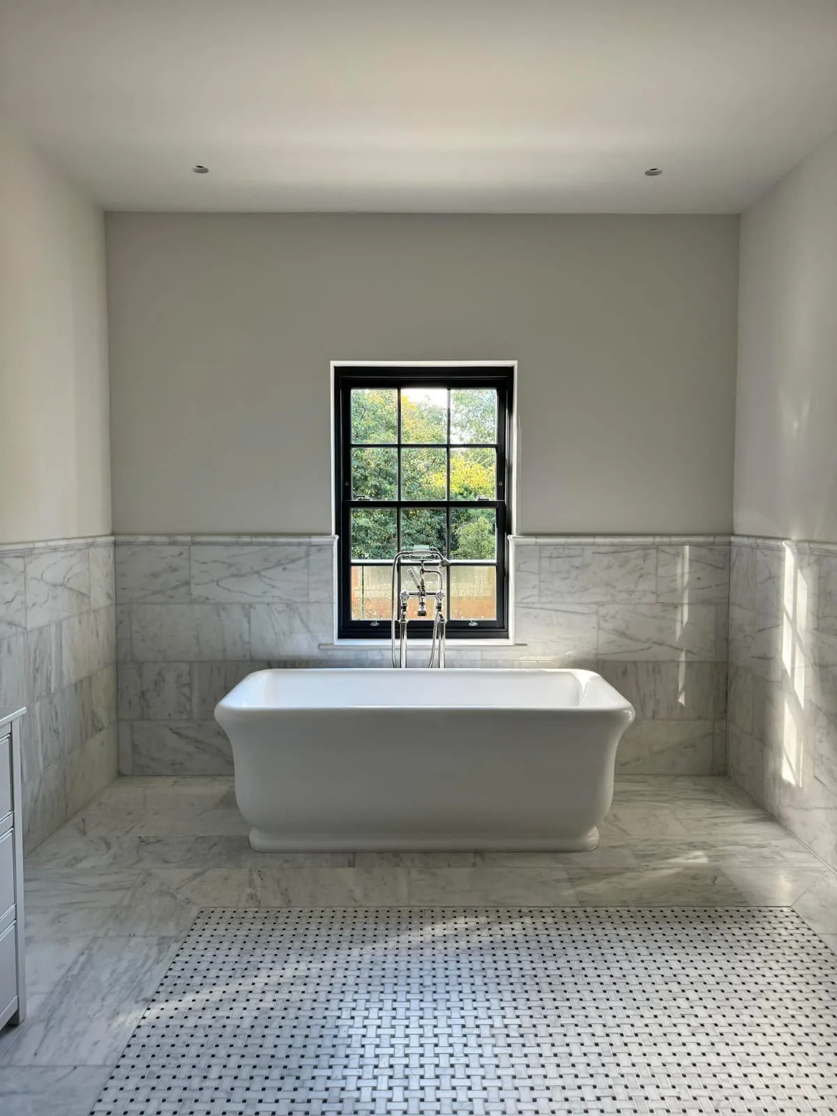 Modern marble bathroom with freestanding bathtub