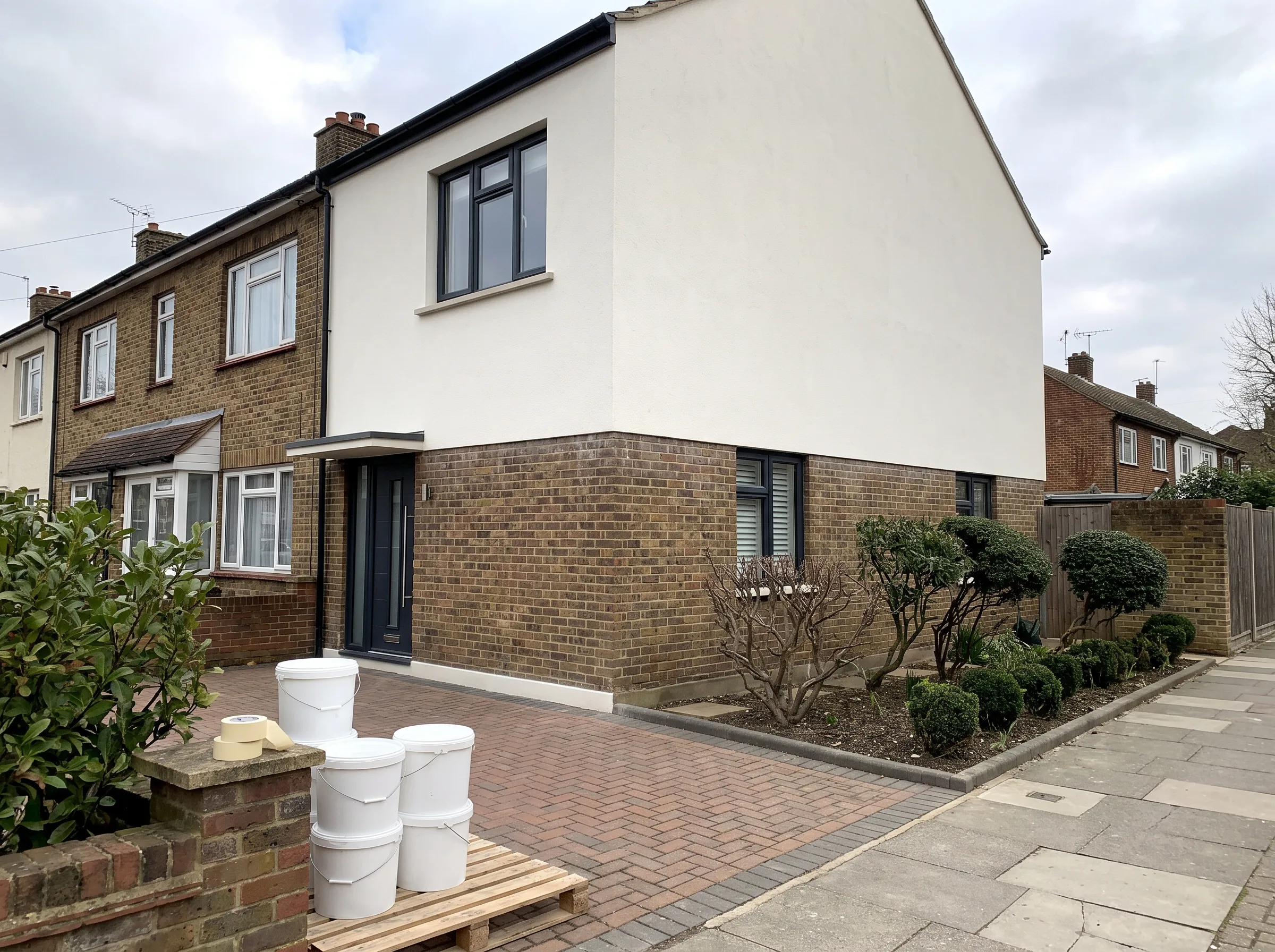 Renovated house exterior showcasing modern brickwork and landscaping