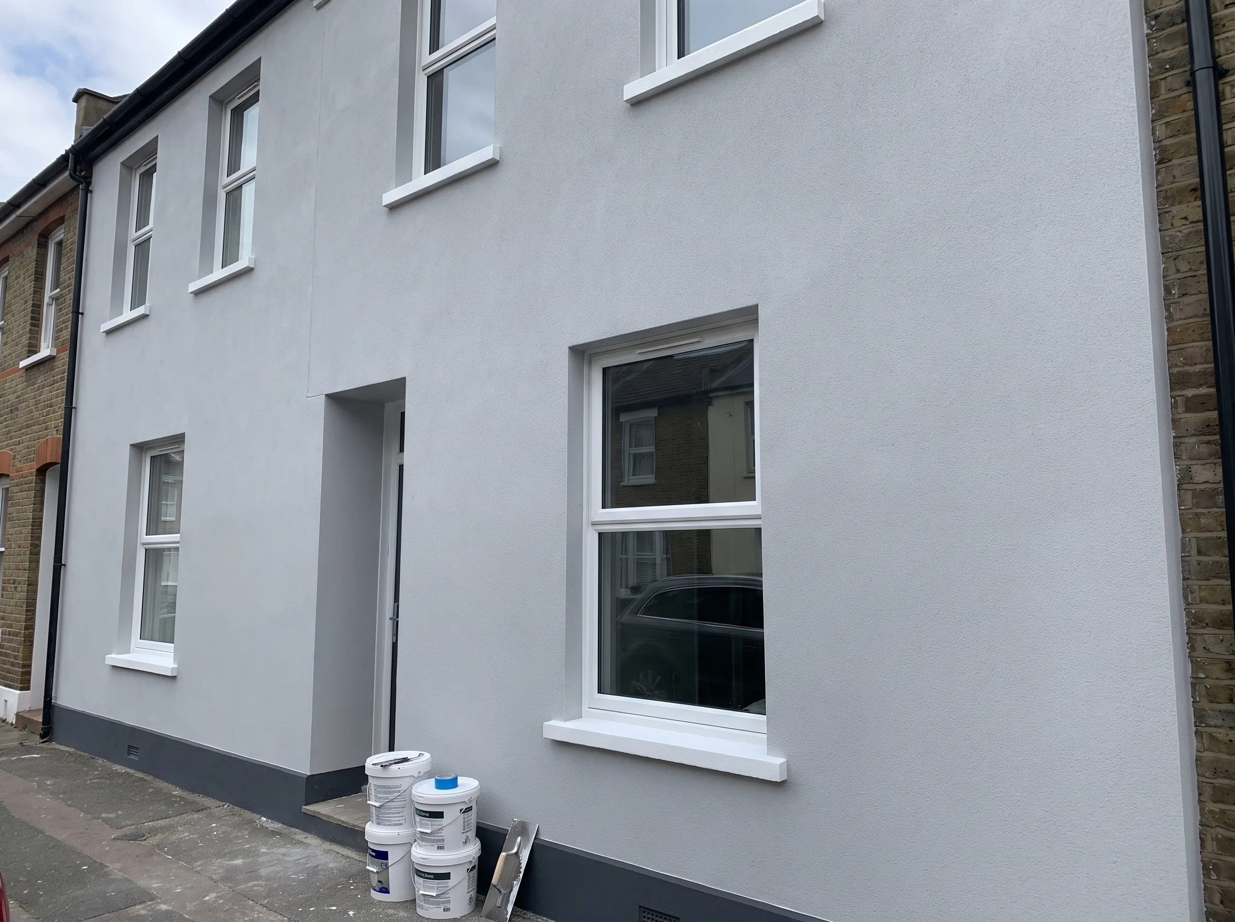 Freshly rendered exterior of a house showcasing modern house rendering service